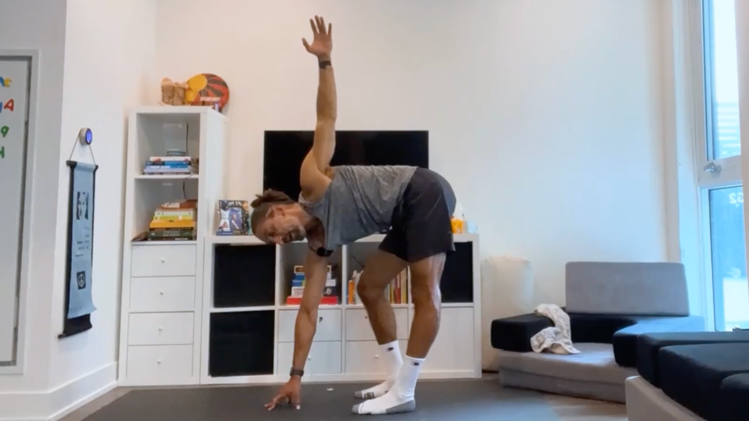 Yoga teacher Jaffer Hussain in Revolved Side Bend, part of his yoga for posture practice